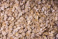 Background of oatmeal. Scattered rolled oats. Close up. Royalty Free Stock Photo